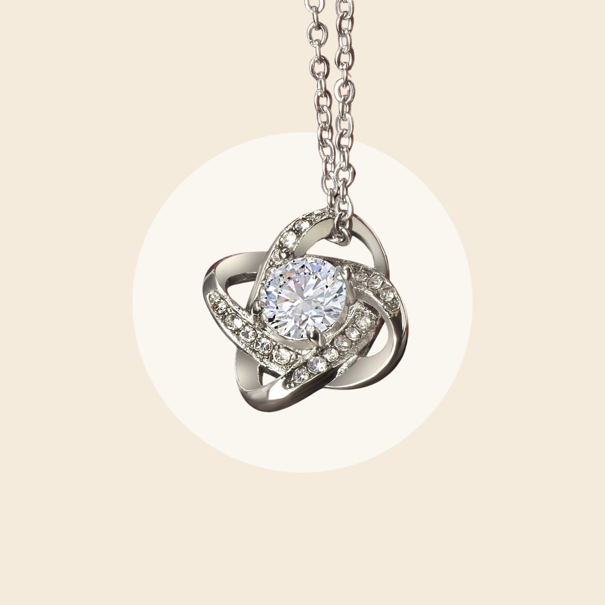 Silver-tone love-knot pendant close-up