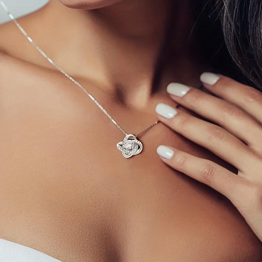 HeartNote love-knot necklace worn on the neck, true size