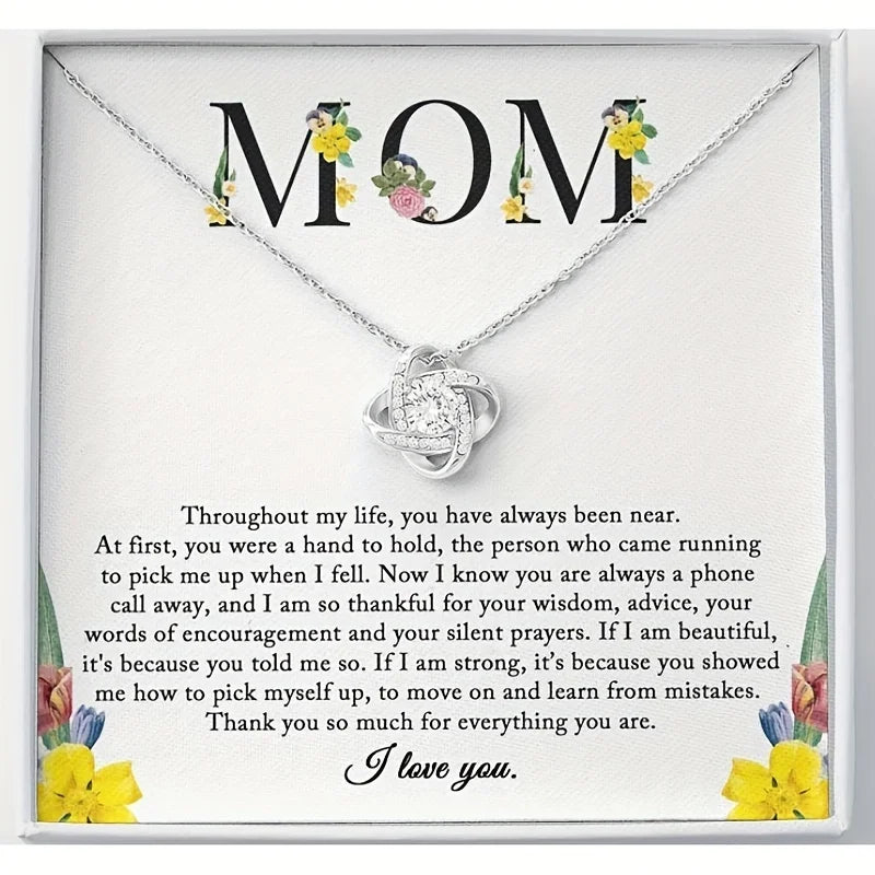 The printed MOM card, every word readable, with the necklace in the box